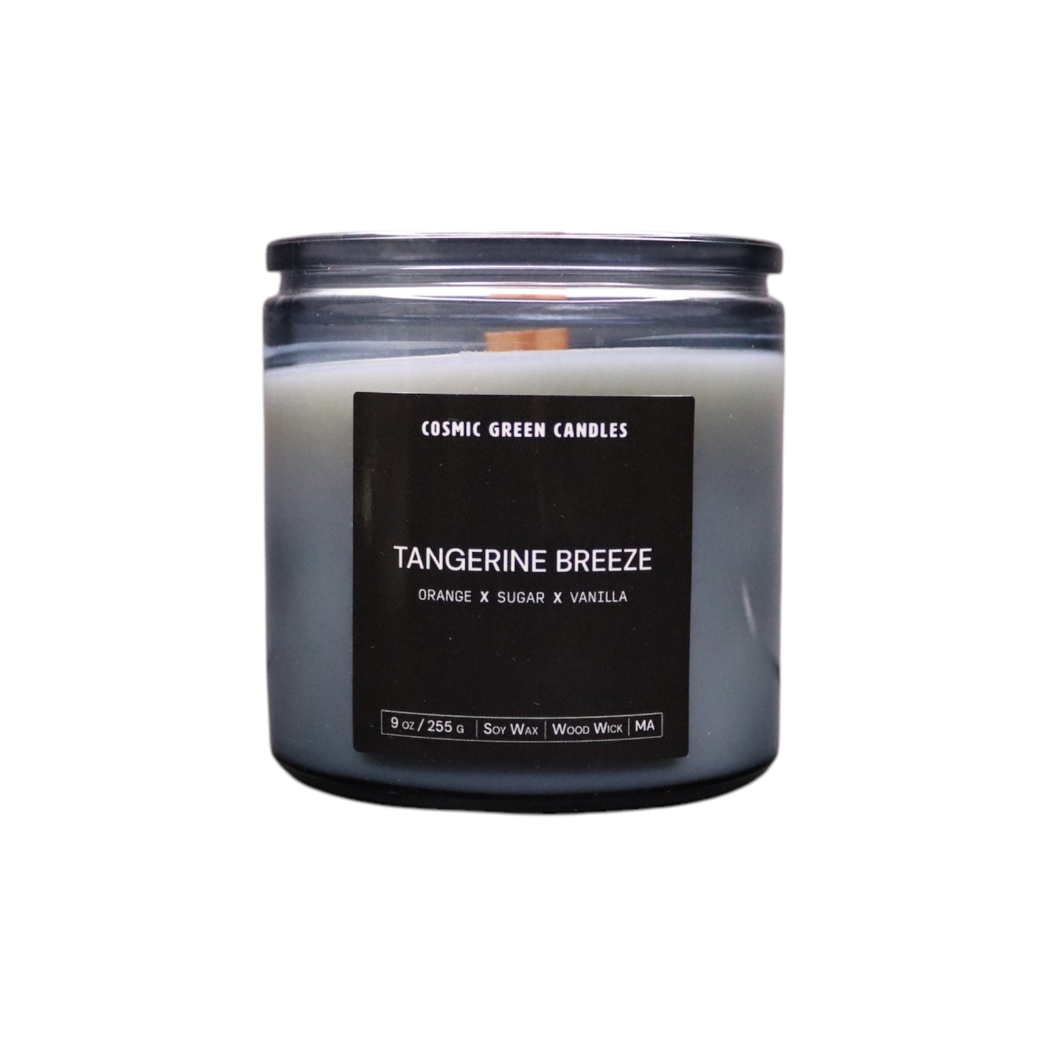 Tangerine Breeze candle in a vibrant orange jar, radiating a fresh citrus aroma.